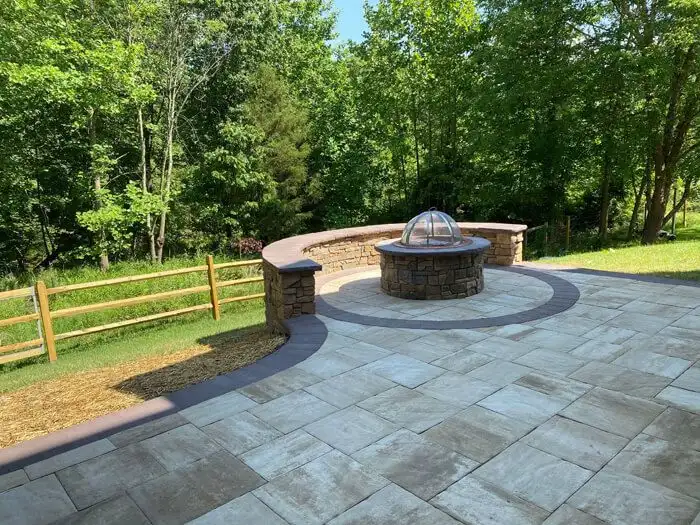 Curved paver patio fire pit seat wall