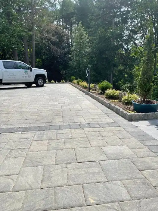 Large paver driveway planting border