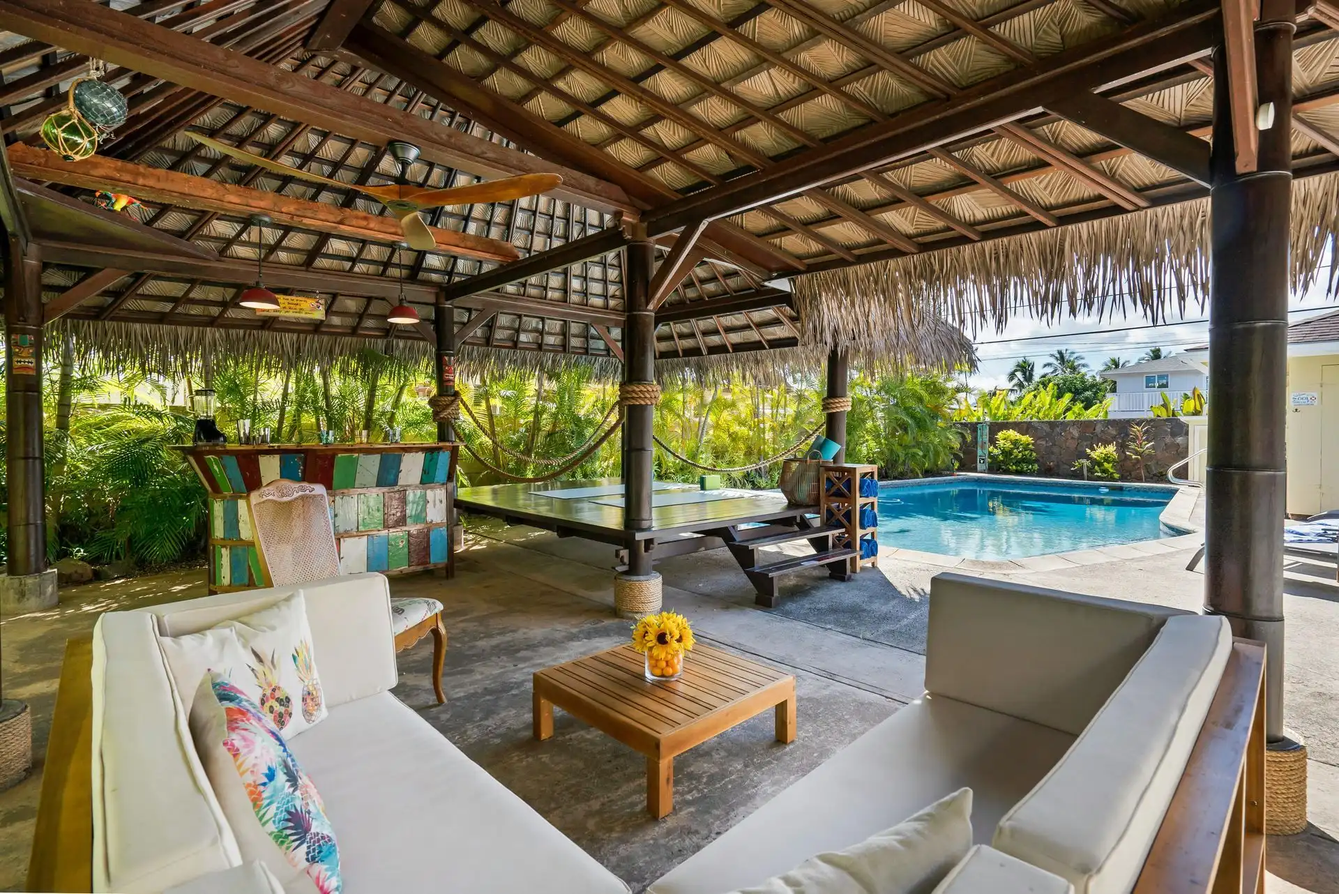 Outdoor pavilion lounge by pool