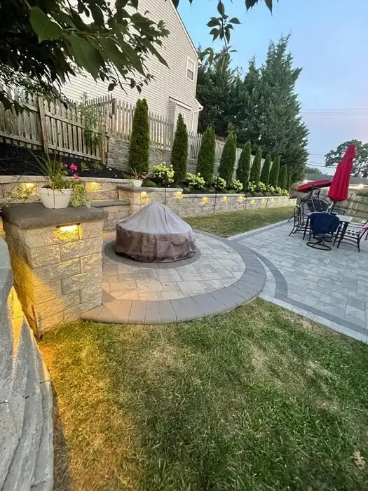 Stone seat wall fire pit dusk