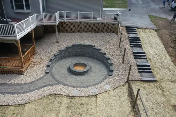 Sunken fire pit patio stone seat wall