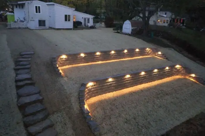 Terraced retaining walls lit stepping stones